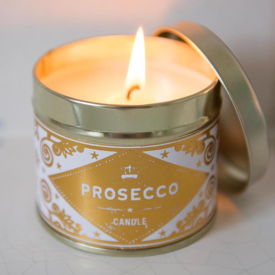 <p>Light and fruity, you can get your spritz of bubbles without drinking any alcohol. The sparkling scent will burn for 40 hours, so that's at definitely a few boxsets worth. <a rel="nofollow noopener" href="https://www.thepresentfinder.co.uk/buy/prosecco-scented-candle_2375.htm" target="_blank" data-ylk="slk:Buy Here;elm:context_link;itc:0;sec:content-canvas" class="link ">Buy Here</a> </p>