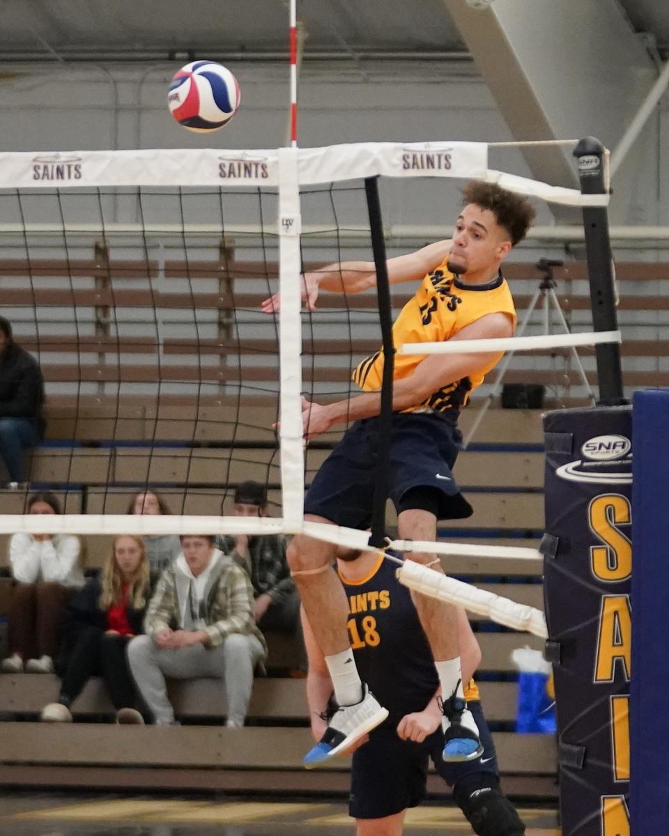 Siena Heights' Ramon Matos slams home a kill during Saturday's match against Mount Vernon Nazarene. [Telegram photo by Mike Dickie]