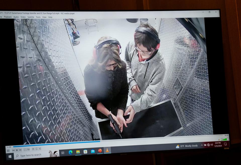 Jennifer Crumbley is shown with her son Ethan Crumbley at a gun range on Nov. 27, 2021, for target practice on a screen in the courtroom of Oakland County Judge Cheryl Matthews on Thursday, Jan. 25, 2024, to begin the trial of Jennifer Crumbley who is being tried in four counts of involuntary manslaughter. Ethan Crumbley killed four students at Oxford High School just days after this surveillance video was taken of them at the range.