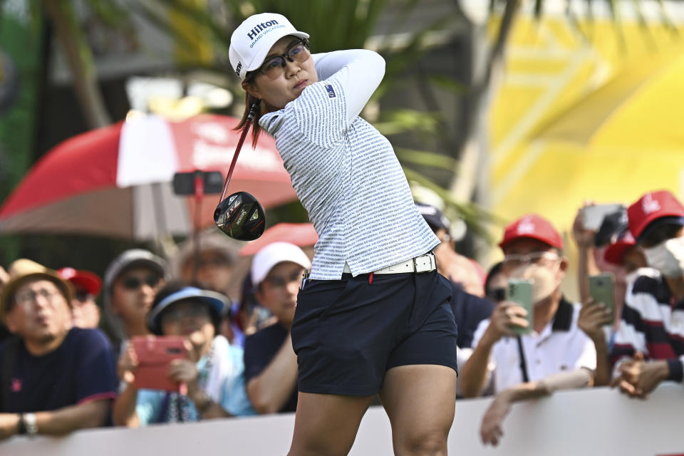 Nasa Hataoka of Japan watches her shot on the 1st hole during the first round of the LPGA Honda Thailand golf tournament in Pattaya, southern Thailand, Thursday, Feb. 23, 2023. (AP Photo/Kittinun Rodsupan)