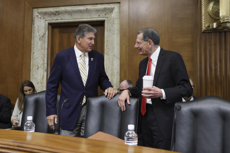 WASHINGTON, DC - MAY 19: U.S. Sen. Joe Manchin (D-WV) (L), Chairman of the Senate Energy and Natural Resources Committee, talks to Sen. John Barasso (R-WY) as Interior Secretary Deb Haaland testifies during a hearing at the Dirksen Senate Office Building on May 19, 2022 in Washington, DC. Secretary Haaland testifies on President Biden's fiscal year 2023 Budget Request for the Department of the Interior. (Photo by Kevin Dietsch/Getty Images)