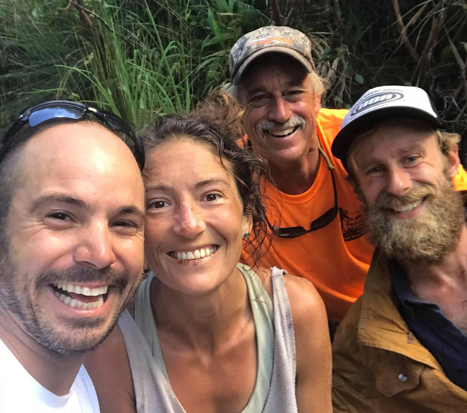 Amanda Eller, a hiker missing in the Maui forest in Hawaii for more than two weeks, poses for a photo with her rescuers – Javier Cantellops, Troy Helmer and Chris Berquist.