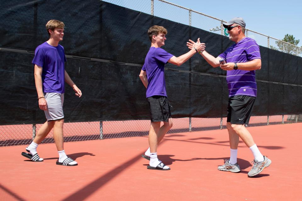 Topeka West Miles Cusick and Ian Cusick accept their award Saturday at Kossover Tennis Court.