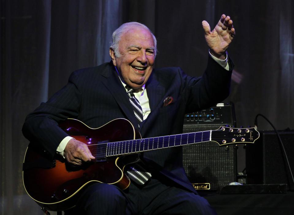 FILE - This June 5, 2011 file photo shows jazz great John "Bucky" Pizzarelli after being inducted into the New Jersey Hall of Fame during the induction ceremony in Newark, N.J. Pizzarelli died March 25 at the family home in Saddle River, New Jersey. (AP Photo/Rich Schultz, File)