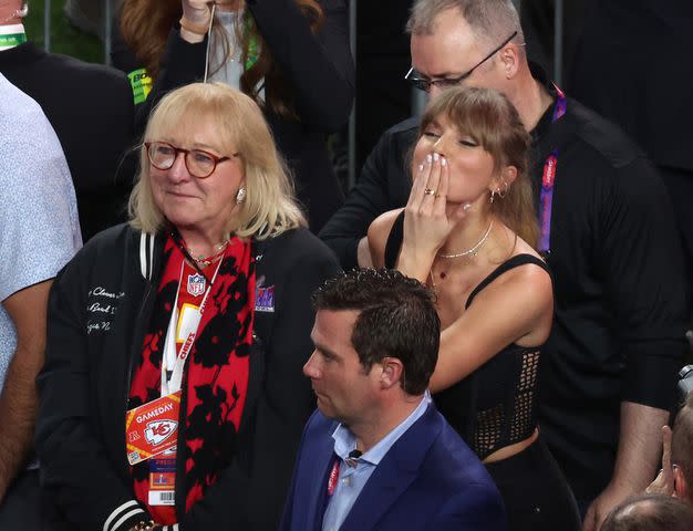 <p>Rob Carr/Getty</p> Taylor Swift blows a kiss to Travis Kelce on Feb. 11, 2024 in Las Vegas