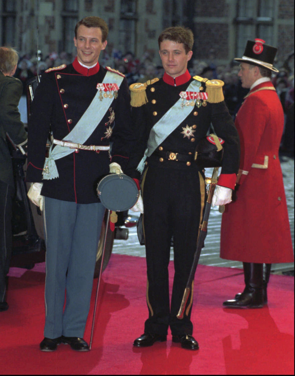 FILE - Denmark's Prince Joachim, left and his elder brother and best man, Crown Prince Frederik, arrive at Frederiksborg Castle church for Prince Joachim's wedding to Alexandra Manley, in Copenhagen, Denmark, Saturday, Nov. 18, 19915. As a teenager, Crown Prince Frederik felt uncomfortable being in the spotlight, and pondered whether there was any way he could avoid becoming king. All doubts have been swept aside as the 55-year-old takes over the crown on Sunday, Jan. 14, 2024 from his mother, Queen Margrethe II, who is breaking with centuries of Danish royal tradition and retiring after a 52-year reign. (AP Photo/Bjarke Oersted, File)