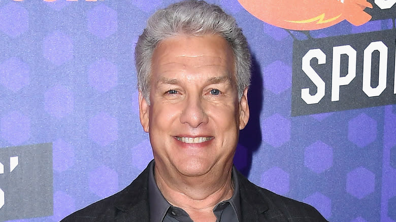 Marc Summers smiling on a red carpet