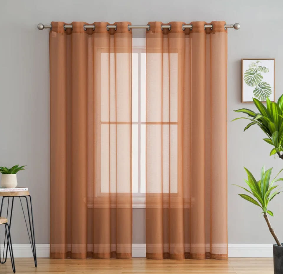 long floor to ceiling rusted orange sheer curtains