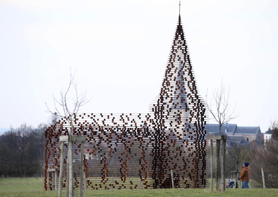 Brussels, Belgium. A see-through church is pictured on a hilltop in Borgloon, 50 miles east of Brussels, on Feb. 20, 2013. The church, designed by Belgian architectual duo Gijs Van Vaerenbergh, is made with 100 layers of steel and weighs 30 tons.