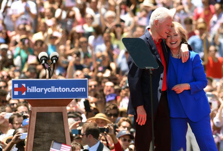 Hillary Clinton and former US President Bill Clinton hug after she officially launched her campaign for the Democratic presidential nomination on June 13, 2015 in New York