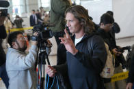 Los Angeles Dodgers pitcher Tyler Glasnow gestures to supporters during the baseball team's arrival at Incheon International Airport, Friday, March 15, 2024, in Incheon, South Korea, ahead of the team's baseball series against the San Diego Padres. (AP Photo/Ahn Young-joon)