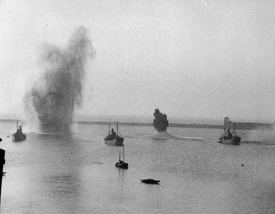 German bombs miss their targets and explode in the sea, during an air raid on Dover, England, in July 1940.