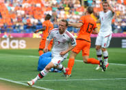 KHARKOV, UKRAINE - JUNE 09: Michael Krohn-Dehli of Denmark turns to celebrate scoring their first goal during the UEFA EURO 2012 group B match between Netherlands and Denmark at Metalist Stadium on June 9, 2012 in Kharkov, Ukraine. (Photo by Lars Baron/Getty Images)