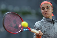 Anhelina Kalinina, of Ukraine, returns the ball against Britain's Emma Raducanu during their match at the Mutua Madrid Open tennis tournament in Madrid, Spain, Tuesday, May 3, 2022. (AP Photo/Manu Fernandez)