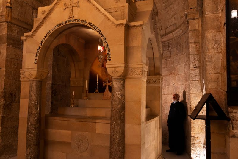 Father Samuel Aghoyan, the Armenian superior at the Church of the Holy Sepulchre stands at the Saint Helena chapel inside the church, during his interview with Reuters, in Jerusalem's Old City