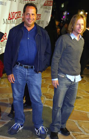 <p>Kevin Winter/Getty Images</p> Jon Lovitz and David Spade in Los Angeles, California in April 2003.