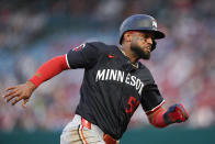 Minnesota Twins' Willi Castro runs to score off a single hit by Byron Buxton during the third inning of a baseball game against the Los Angeles Angels, Friday, April 26, 2024, in Anaheim, Calif. (AP Photo/Ryan Sun)