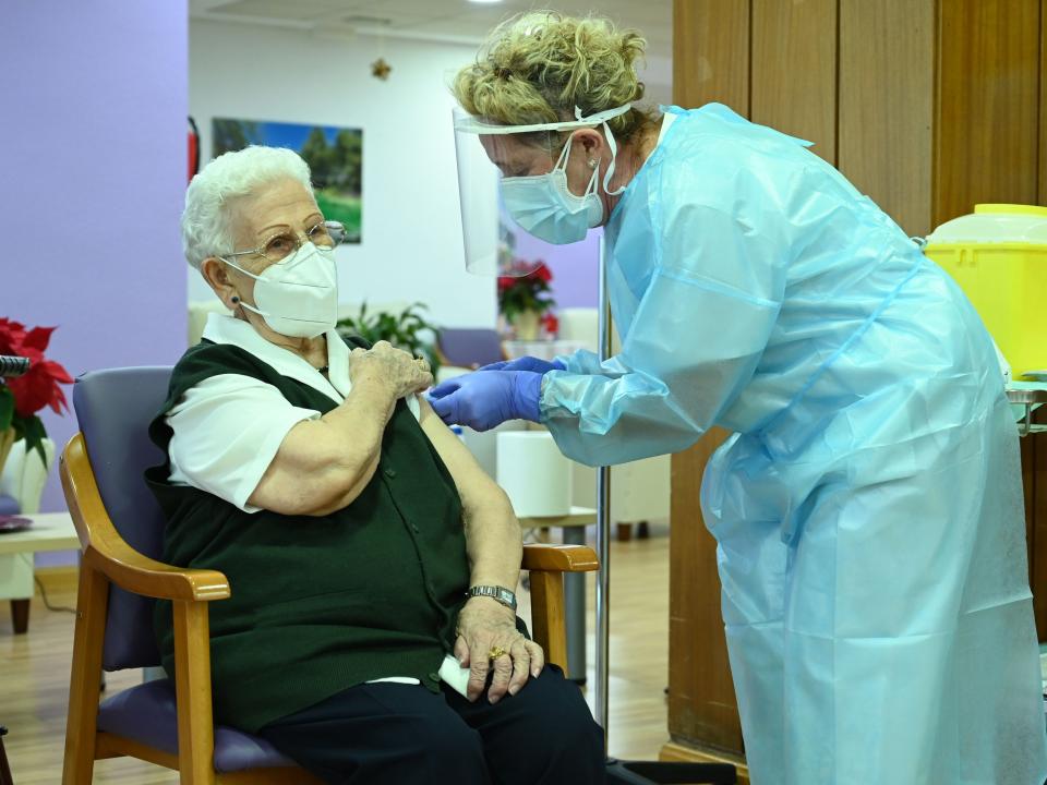 Araceli Hidalgo, a 96-year-old nursing home resident, receives a dose of the Pfizer-BioNTech Covid-19 vaccineLa Moncloa/AFP via Getty Images