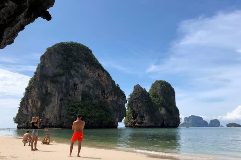 FILE PHOTO: Tourist are seen in a beach in Krabi, Thailand