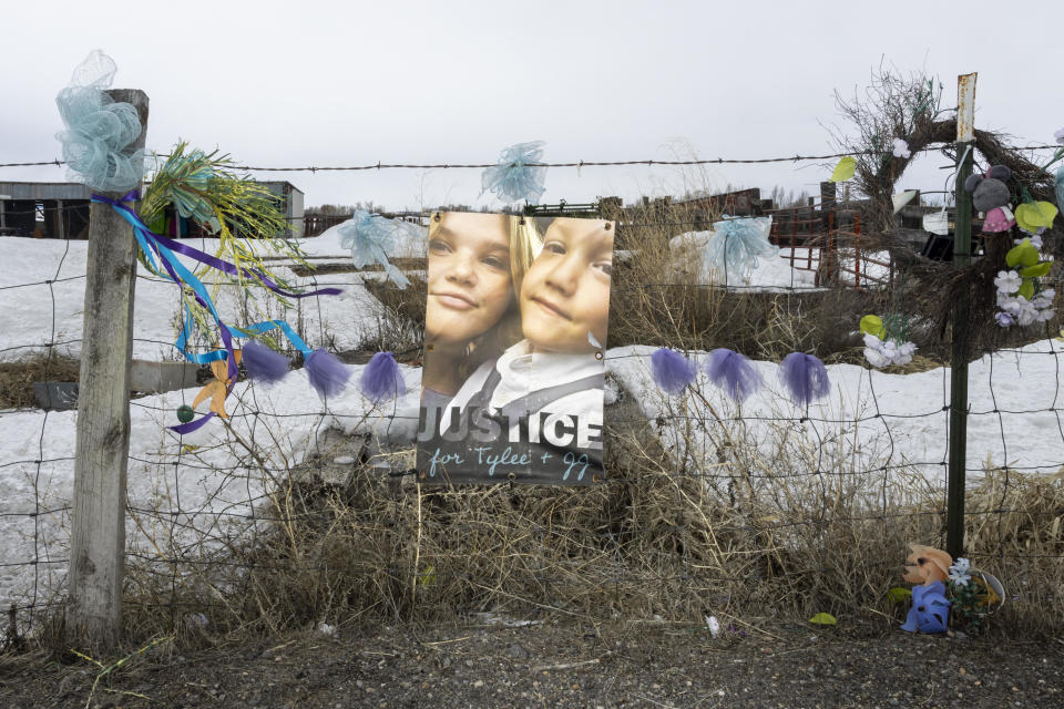 A picture of Tylee Ryan and J.J. Vallow is seen on a fence opposite the property where their bodies were found in 2020, in Rexburg, Idaho. / Credit: NATALIE BEHRING / Getty Images