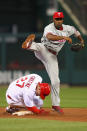 ST. LOUIS, MO - MAY 25: Jimmy Rollins #11 of the Philadelphia Phillies turns a double play over Tyler Greene #27 of the St. Louis Cardinals at Busch Stadium on May 25, 2012 in St. Louis, Missouri. (Photo by Dilip Vishwanat/Getty Images)