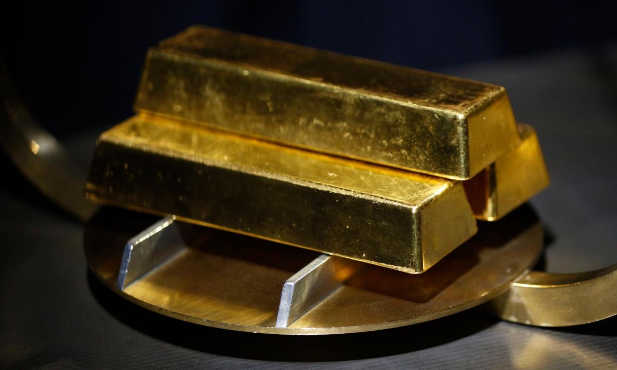 <span>A man allegedly told his victim that her identity had been stolen and he could protect her assets – but only if she converted them to gold bars and turned them over.</span><span>Photograph: Luke Sharrett/Bloomberg via Getty Images</span>