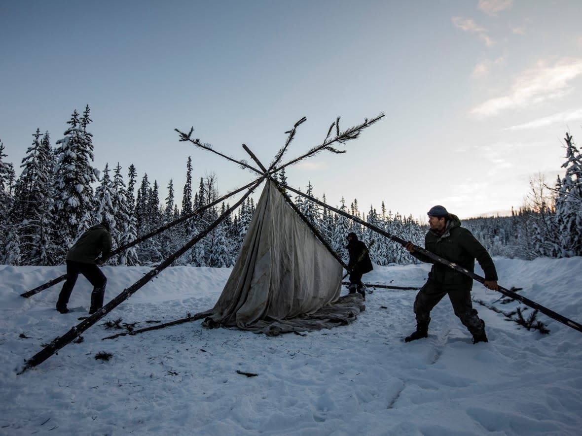 Supporters of the Wet'suwet'en hereditary chiefs who oppose the Coastal GasLink pipeline set up a support station. A lawsuit claims that RCMP and security officers do not have the right to impede Wet'suwet'en access to traditional territory outside the narrow scope of an injunction.  (Jason Franson/The Canadian Press - image credit)