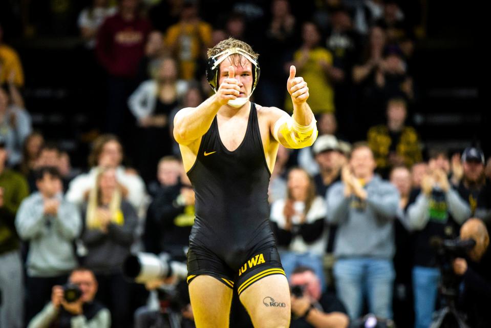 Iowa's Nelson Brands gives two thumbs up after scoring a major decision at 174 pounds during a Cy-Hawk Series NCAA men's wrestling dual against Iowa State, Sunday, Dec. 4, 2022, at Carver-Hawkeye Arena in Iowa City, Iowa.