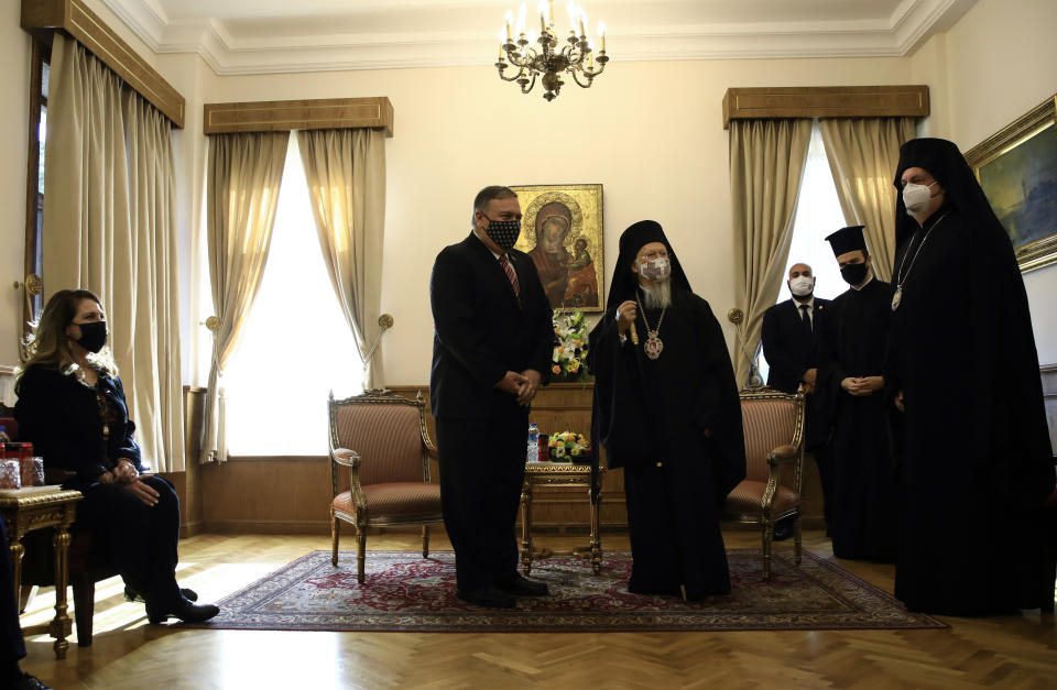 Ecumenical Patriarch Bartholomew I, center right, the spiritual leader of the world's Orthodox Christians, meets with US Secretary of State Mike Pompeo, center left, as Pompeo 's wife Suzan, left, looks on in Istanbul, Tuesday, Nov. 17, 2020. Pompeo is visiting Turkey as part of a seven-nation trip to Europe and the Middle East. (Umit Bektas/Pool via AP)