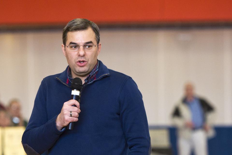 U.S Rep. Justin Amash, R-Cascade Township, speaks to the audience during a town hall meeting on Thursday, Feb. 23, 2017 at the Full Blast Recreation Center in Battle Creek, Mich.  (Carly Geraci/Kalamazoo Gazette-MLive Media Group via AP)