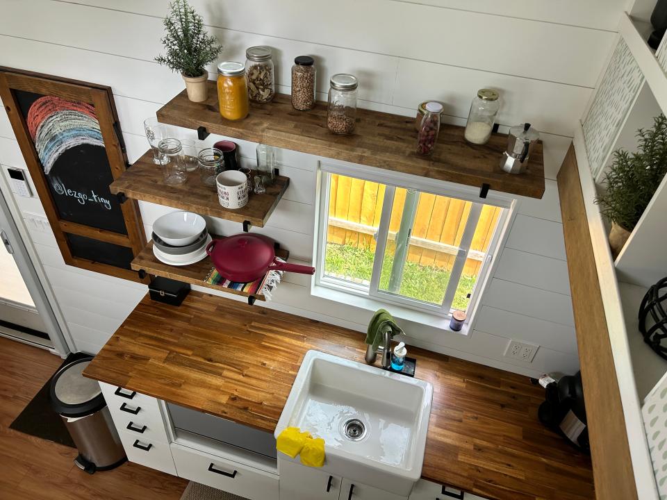 overview of kitchen with wood shelves