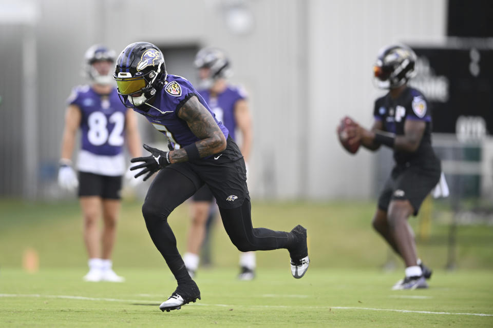 Baltimore Ravens wide receiver Rashod Bateman takes part in drills at the NFL football team's training camp in Owings Mills, Md., Wednesday, July 27, 2022. (AP Photo/Gail Burton)