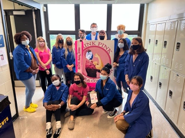 Students in the Health Occupations/HOSA (Health Occupations Students of America) club at Somerset County Vocational & Technical High School pose for a photo while collecting for their fundraiser.