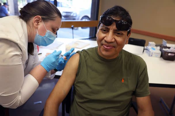 PHOTO: In this Sept. 9, 2022, file photo, a man gets an influenza vaccine from a pharmacist during an event hosted by the Chicago Department of Public Health at the Southwest Senior Center in Chicago. (Scott Olson/Getty Images)