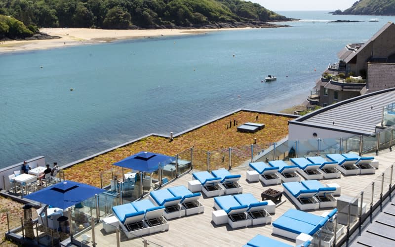 Luxury spa hotel Salcombe Harbour has a magnificent view of Salcombe bay, with its twinkling seas, sandy beaches and pastel cottages