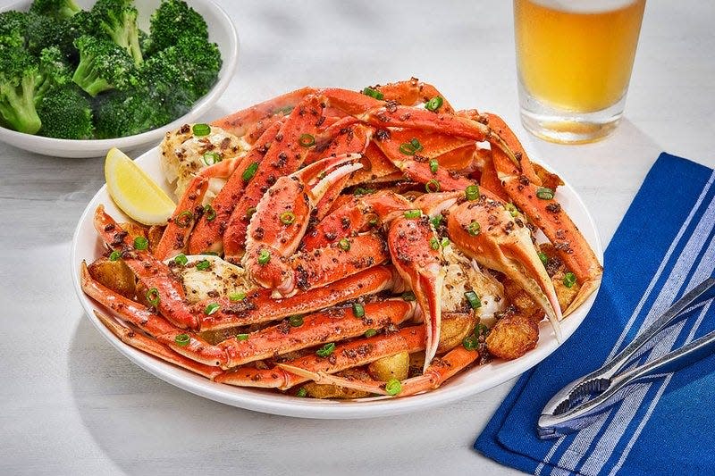 A platterful of crab is on display as Flavor Flav announces the return of Red Lobster's Crabfest