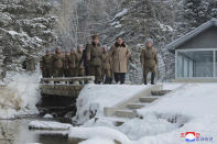 This undated photo provided on Wednesday, Dec. 4, 2019, by the North Korean government shows North Korean leader Kim Jong Un, center, visits Mount Paektu area, North Korea. North Korean leader Kim Jong Un rode a white horse up a sacred mountain on his second symbolic visit there in less than two months, state media reported Wednesday, as his country is threatening provocation if the United States refuses to make concessions in nuclear diplomacy by year’s end. Independent journalists were not given access to cover the event depicted in this image distributed by the North Korean government. The content of this image is as provided and cannot be independently verified. Korean language watermark on image as provided by source reads: "KCNA" which is the abbreviation for Korean Central News Agency. (Korean Central News Agency/Korea News Service via AP)