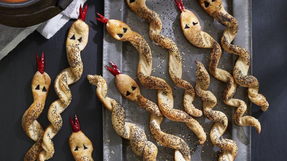 breadstick rattlers and dipping sauce, a spooky savory treat you might make as a halloween activity