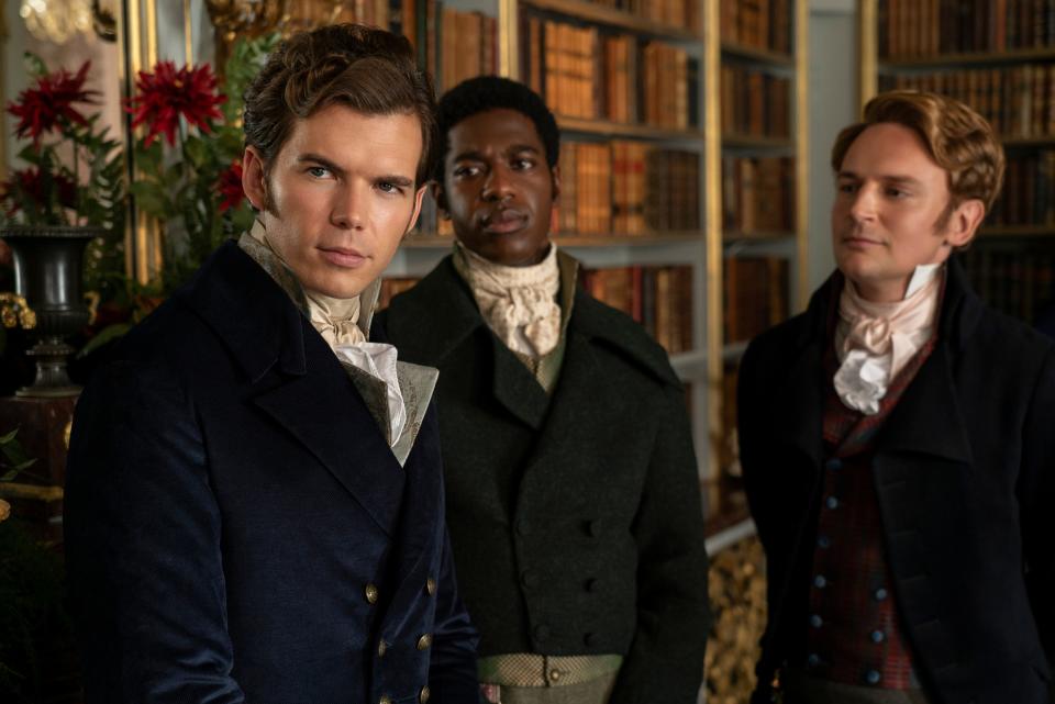 Luke Newton as Colin Bridgerton, Jorden Myrie as Lord Stanton, and Joe Barnes as Lord Wilding.