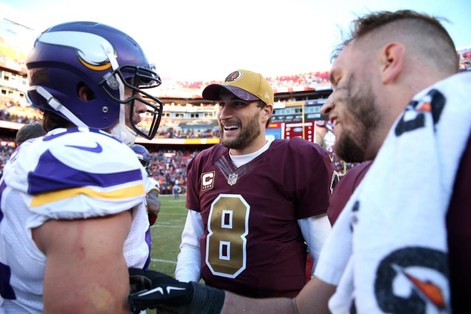 LANDOVER, MD - NOVEMBER 13: Quarterback Kirk Cousins #8 of the Washington Redskins meets with outside linebacker Chad Greenway #52 of the Minnesota Vikings after the Washington Redskins defeated the Minnesota Vikings 26-20 at FedExField on November 13, 2016 in Landover, Maryland. (Photo by Patrick Smith/Getty Images)