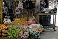 <p>A vendor sleeps at his vegetable shop at a main market in Colombo, Sri Lanka, May 31, 2016. (Reuters/Dinuka Liyanawatte) </p>