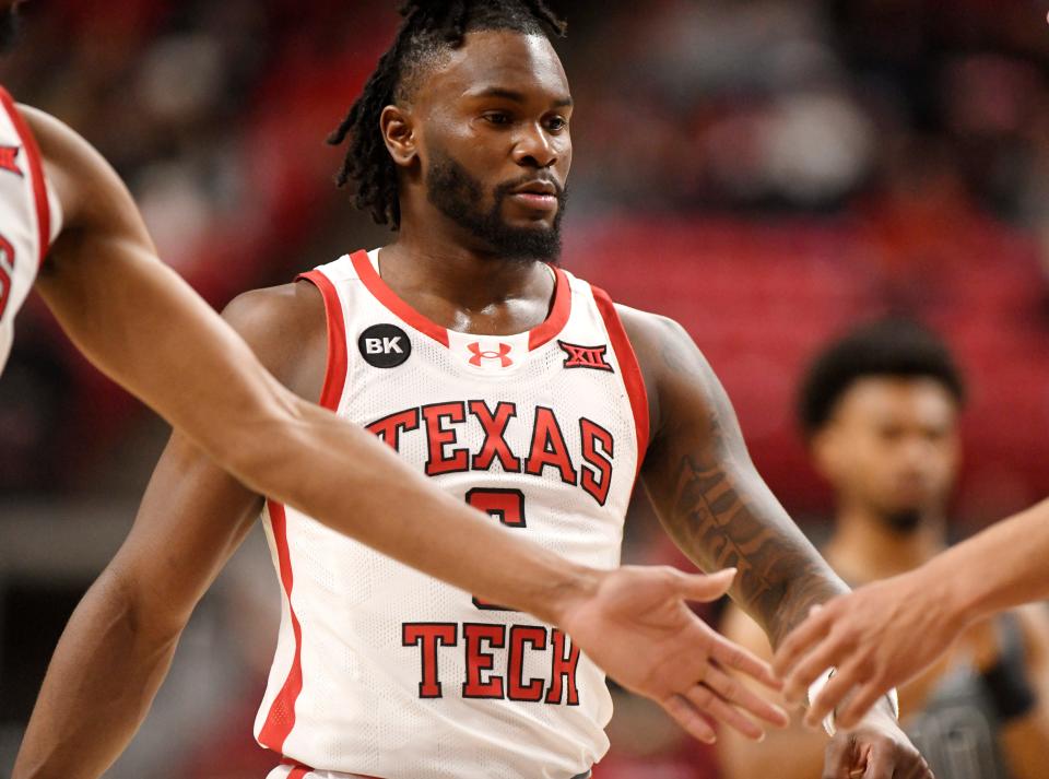 Texas Tech's guard Joe Toussaint (6) high-fives his teammates during the non-conference basketball game against Oral Roberts, Tuesday, Dec. 12, 2023, at United Supermarkets Arena.