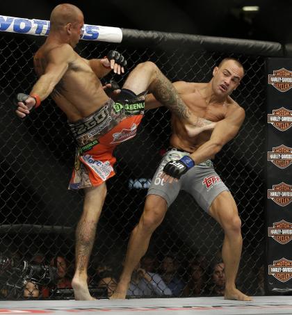 Donald Cerrone kicks Eddie Alvarez during their lightweight fight. (AP)