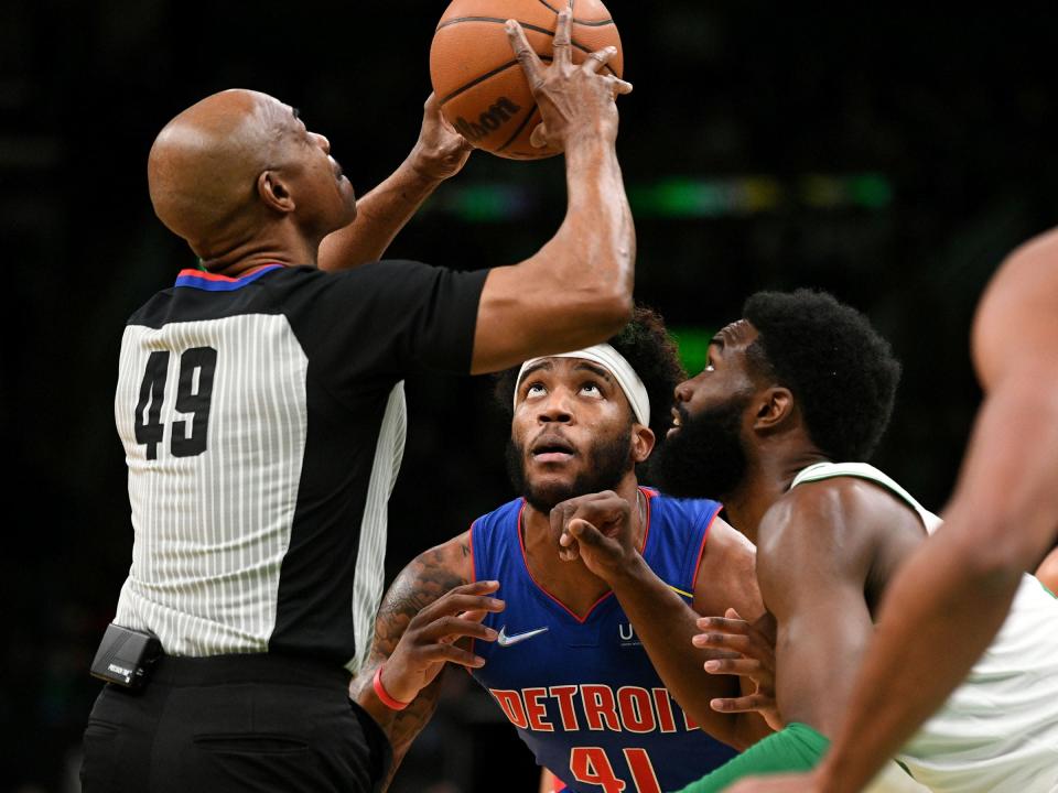 Boston Celtics guard Jaylen Brown (7) and Detroit Pistons forward Saddiq Bey (41) wait for a jump ball during the first half at the TD Garden on Feb. 16, 2022.