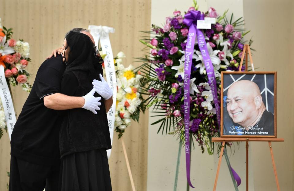 People gather outside Saint Stephen Martyr Catholic Church