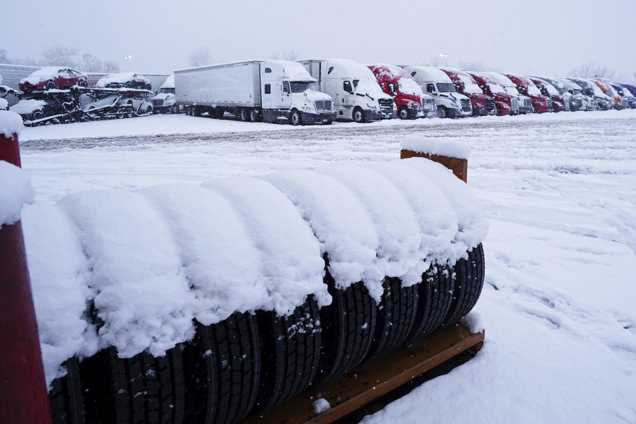 In this photo provided by Hung T. Vu, truckers park their trailers in the TA Center parking lot by Interstate 5 as snow falls in Redding, Calif., Friday, Feb. 24, 2023. Heavy rain and snow are pounding California and other parts of the West in the latest winter storm to hit the United States. Interstate 5, the West Coast's major north-south highway, was closed south of the Oregon border as snow fell to the floor of the Sacramento Valley and in a high mountain pass north of Los Angeles, where blizzard warnings were in effect. (Hung T. Vu via AP)