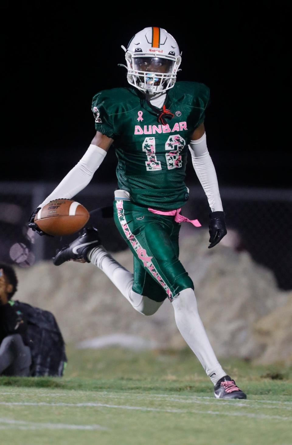 Dunbar defender Garyan Burger returns an interception for a touchdown. The Dunbar High School Tigers defeated the visiting South Fort Myers Wolfpack Friday night, October 27, 2023. Dunbar clinched the district title with a final score of 41-17.