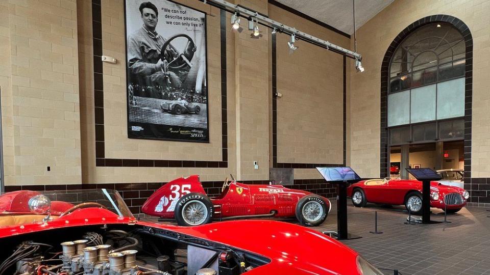 a group of ferrari cars inside saratoga auto museum