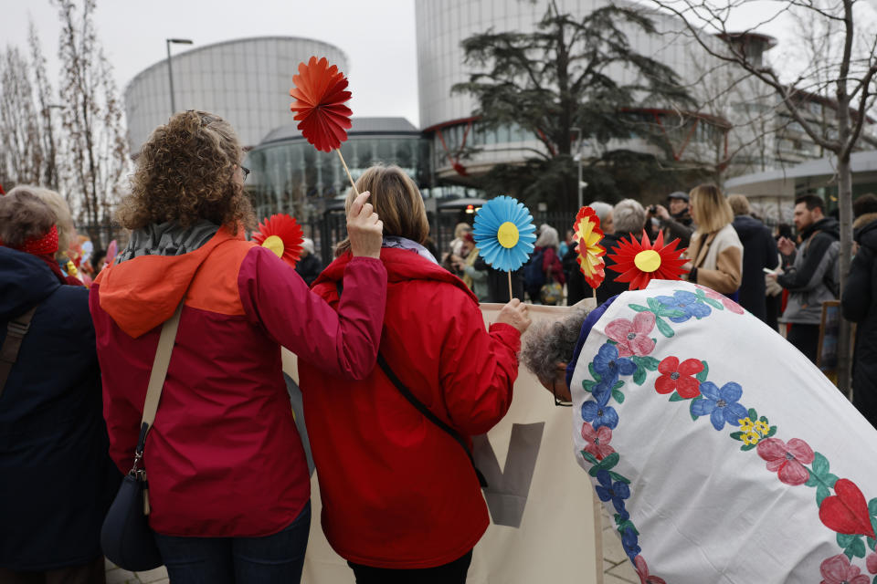 Swiss seniors protest outside the European Court of Human Rights Wednesday, March 29, 2023 in Strasbourg, eastern France. A group of Swiss seniors are taking their government to the European Court of Human Rights to demand more action on climate change which, they say, is seriously affecting their lives. (AP Photo/Jean-Francois Badias)