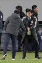 Japan's head coach Hajime Moriyasu, facing camera, shake hands with his North Korean counterpart Sin Yong Nam at the end of the FIFA World Cup 2026 and AFC Asian Cup 2027 preliminary joint qualification round 2 match between Japan and North Korea at the National Stadium Thursday, March 21, 2024, in Tokyo. (AP Photo/Eugene Hoshiko)